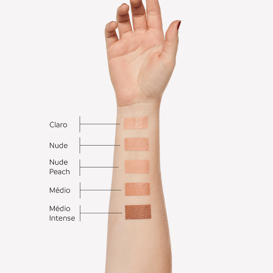 Cinco cores de Photoage Stick Color aplicadas no braço: Claro, Nude, Nude Peach, Médio e Médio Intense